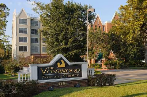 Exterior view of The Vosswood Nursing Center sign with the building behind.