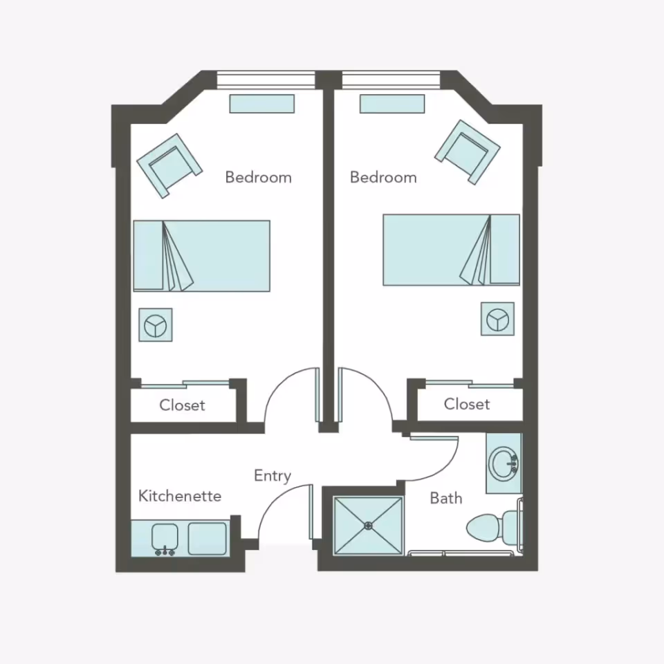 Floor plan of a living space with two bedrooms, each containing a bed, chair, and closet. There is a shared entry area leading to a kitchenette on the left and a bathroom on the right with a shower, toilet, and sink.