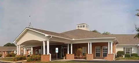 Brookdale Browns Creek exterior: single-story building with a covered entrance and brick columns.