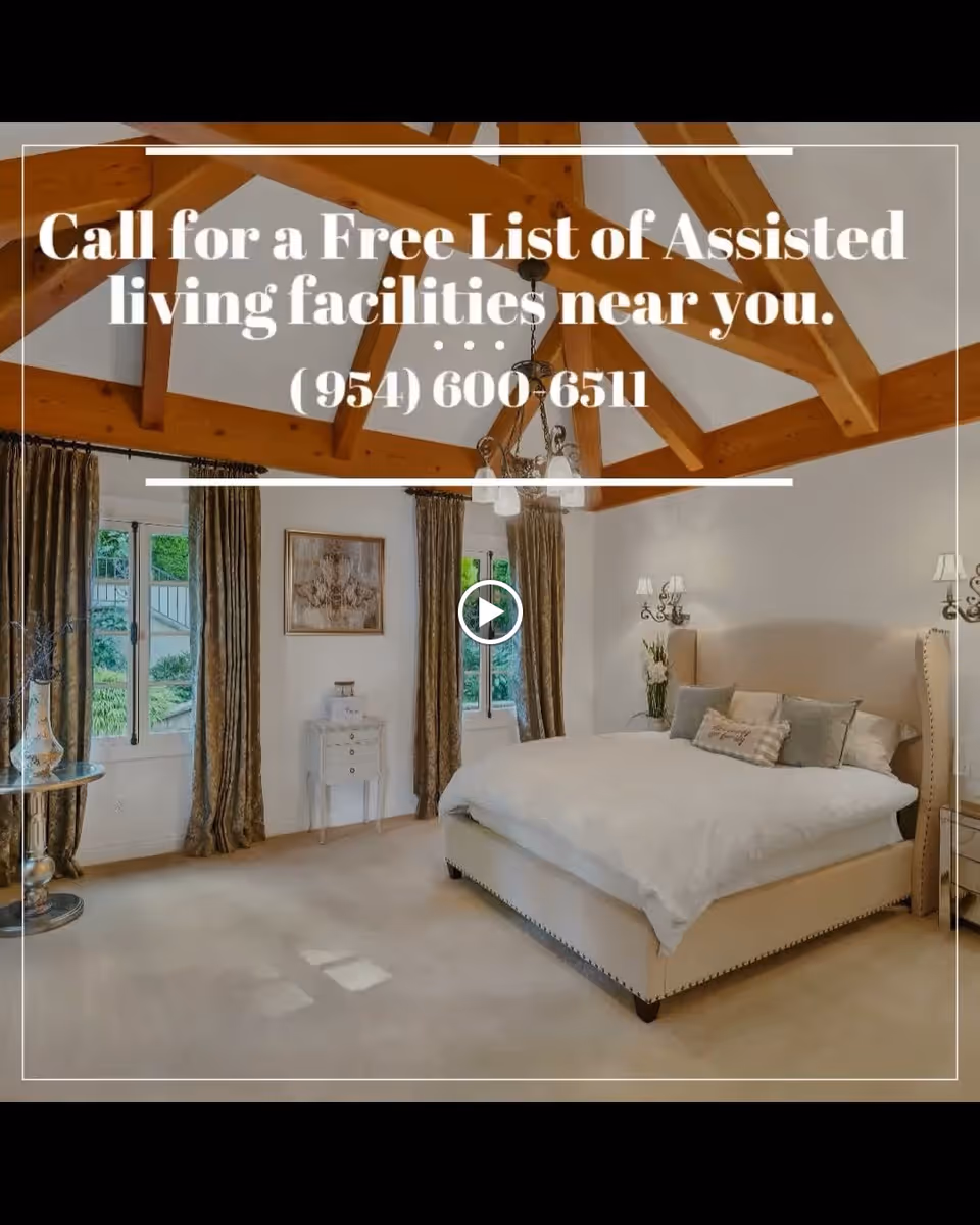 Bright bedroom with a large upholstered bed, exposed wooden ceiling beams, chandelier, windows with curtains and decorative furniture.