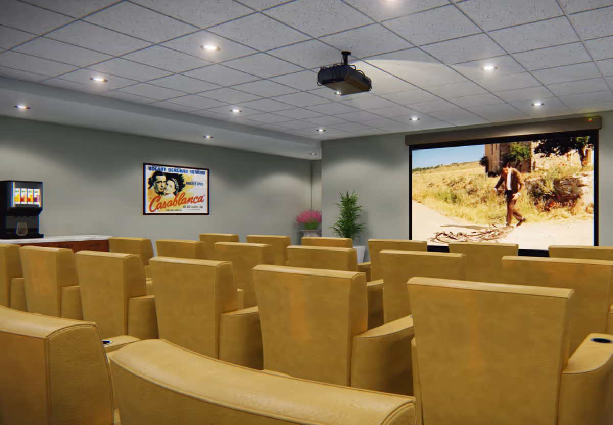 Small screening room with rows of tan theater seats facing a projector screen showing a movie, a ceiling-mounted projector, and a drink station at the side.