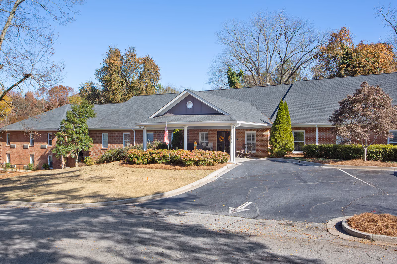 Bethel Gardens Assisted Memory Care building: a single-story brick exterior with front entrance and landscaping.