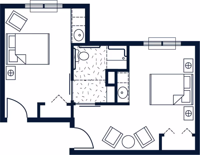 Blueprint-style floor plan of a two-bedroom apartment showing two beds, a central bathroom, and a small seating area.