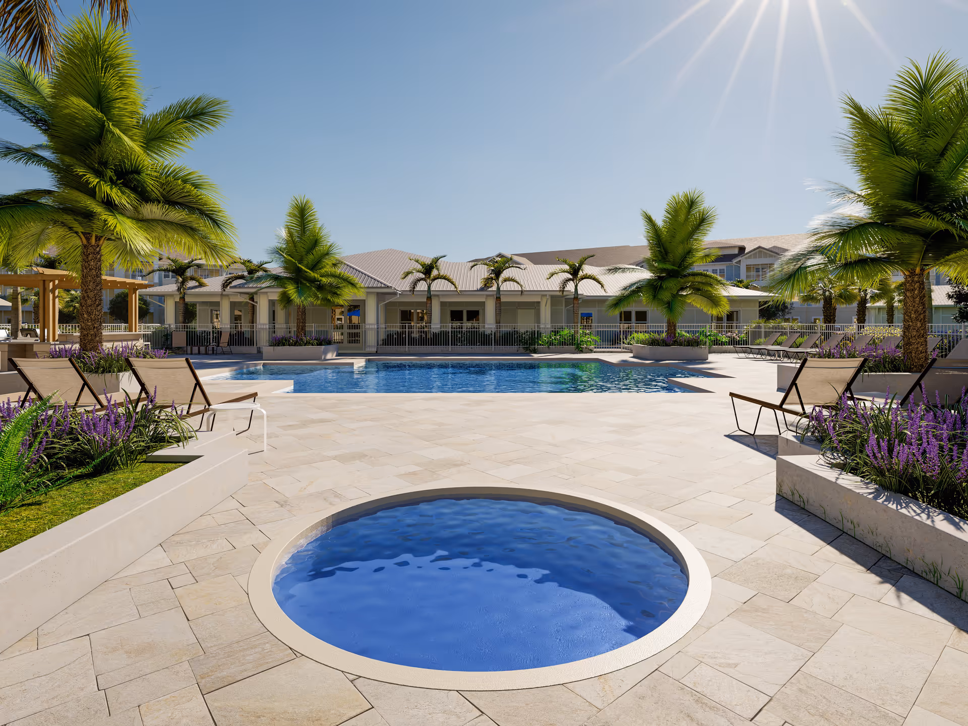 Outdoor resort-style pool area with a circular hot tub in the foreground, lounge chairs, palm trees, and a low-rise building under a clear sunny sky.