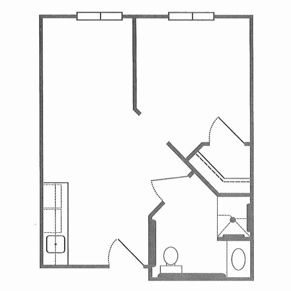 Black-and-white floor plan of a studio apartment showing a main living area with a kitchenette, a bathroom with toilet and shower, closets, doors and windows.