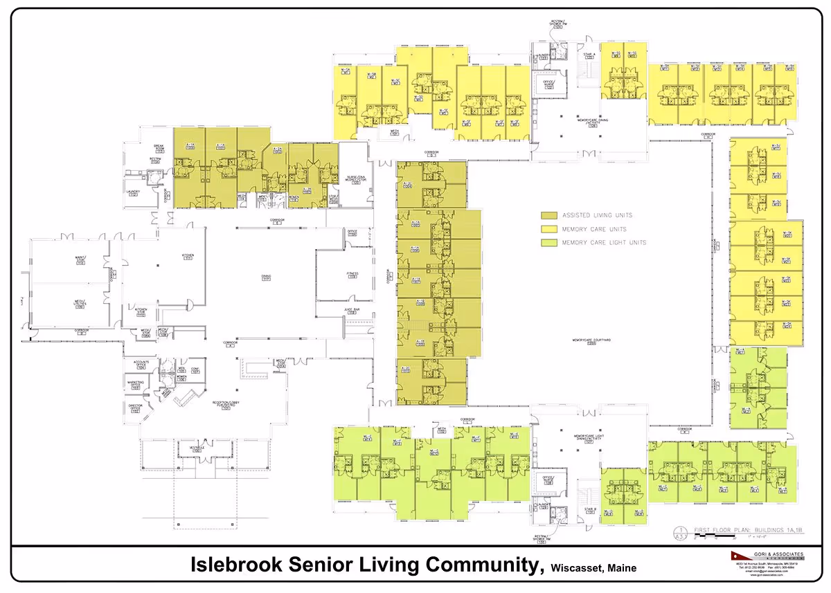 Architectural floor plan of Islebrook Senior Living Community in Wiscasset, Maine, showing layout of assisted living units, memory care units, and memory care light units, with color-coded sections in yellow and green. The plan includes labeled rooms such as dining, kitchen, offices, and corridors surrounding a central courtyard.