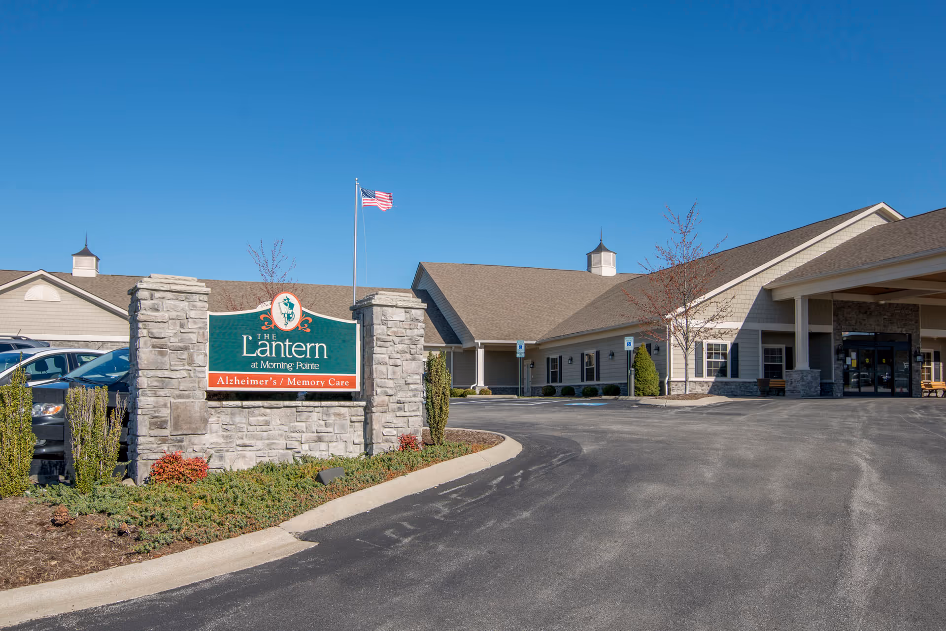 Exterior view of The Lantern at Morning Pointe Alzheimer's Center, Frankfort, with sign, driveway, and entrance.