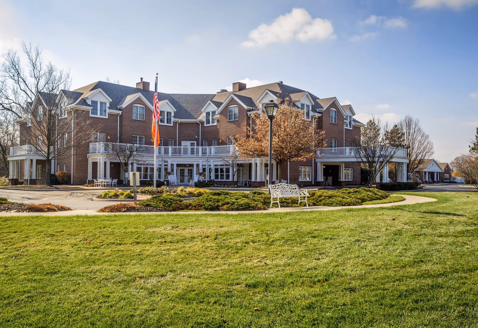 Exterior view of Bickford of Worthington senior living facility with landscaped grounds.