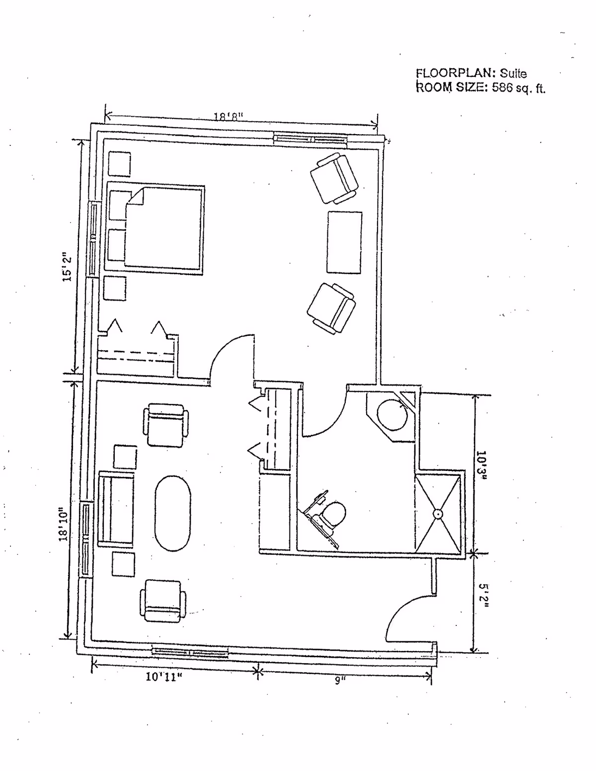 Architectural floor plan of a suite measuring 586 square feet, showing a bedroom area with a bed and nightstands, a living area with chairs and a coffee table, and a bathroom with a toilet, sink, and shower.