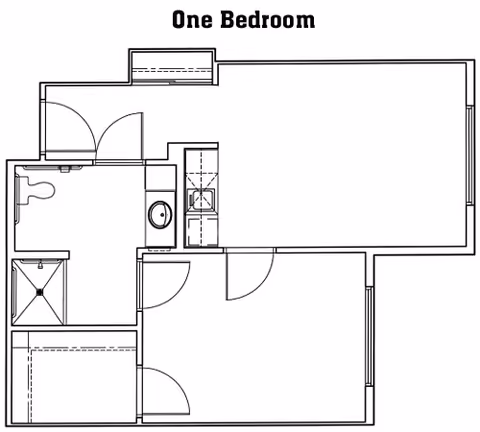 Architectural floor plan of a one-bedroom unit showing a bedroom, bathroom with shower and toilet, a small kitchen area, and a living space.