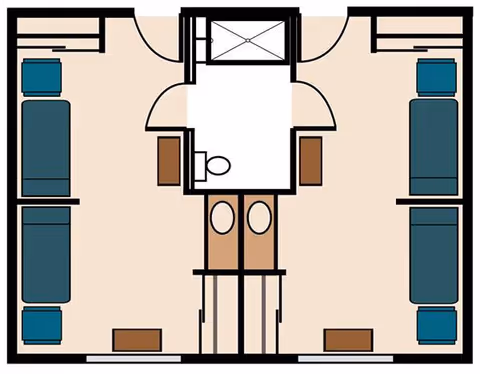 Floor plan of a memory care facility room layout showing two separate sleeping areas each with a bed, nightstand, and chair. A shared bathroom with a shower, toilet, and two sinks is located centrally between the two rooms.