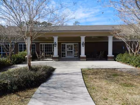 Front entrance of Resthaven Nursing & Rehabilitation Center with columns and walkway.