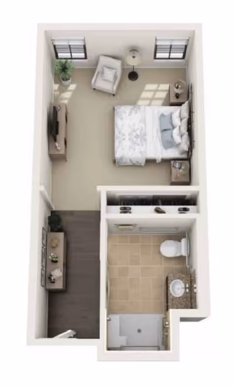 Top-down view of a small apartment layout showing a bedroom with a bed, armchair, two windows, a TV on a stand, and a nightstand. Adjacent to the bedroom is a bathroom with a toilet, sink with countertop, and a shower. There is also a small hallway area with a console table and decorative items.