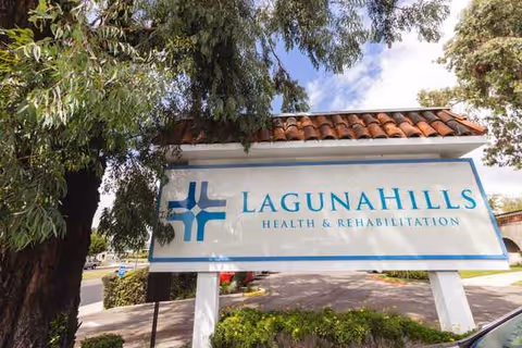 Laguna Hills Health & Rehabilitation sign at facility entrance with trees