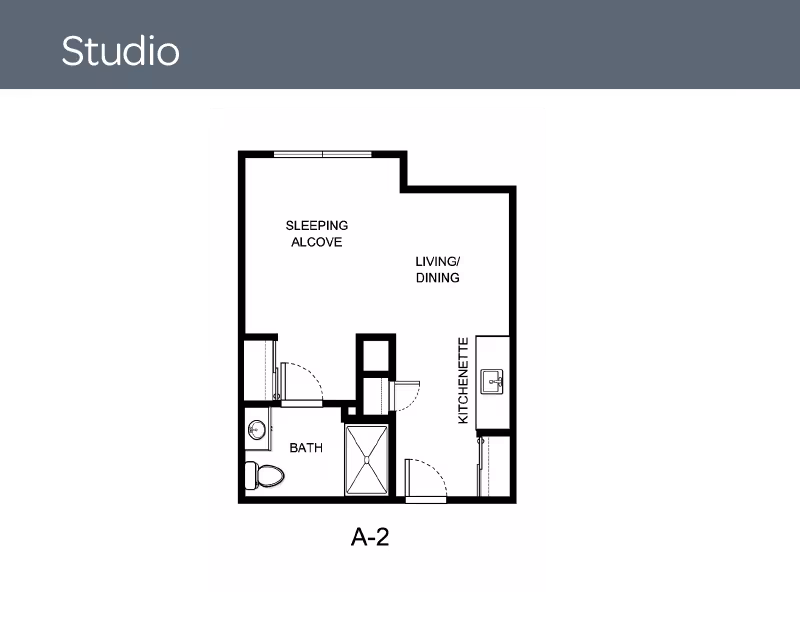 Floor plan of a studio apartment labeled A-2, showing a sleeping alcove, living/dining area, kitchenette, and bathroom.