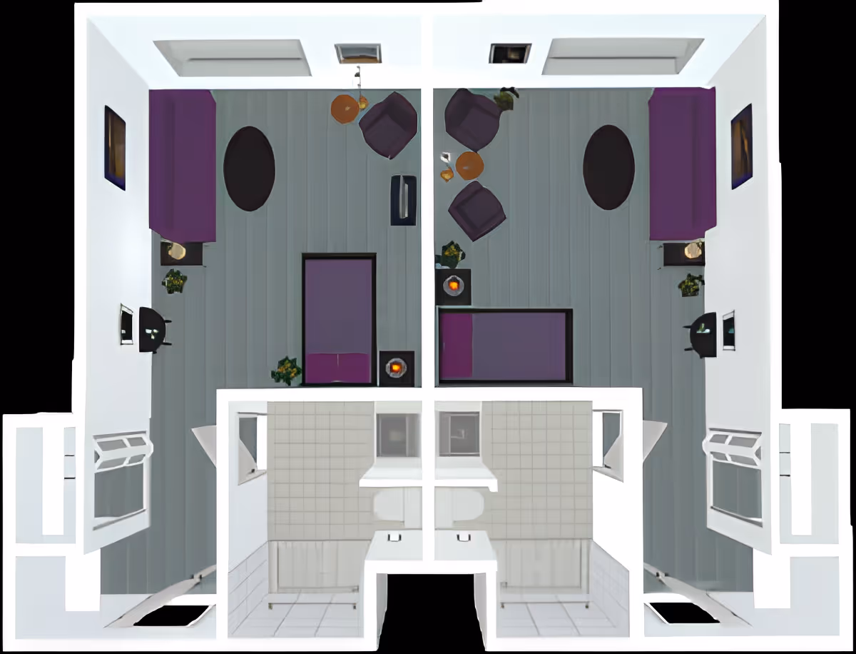 Top-down floor plan showing two mirrored studio rooms with beds, seating areas, and a shared central bathroom.