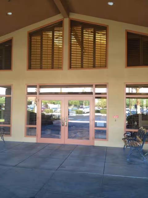 Front entrance of Rancho Mirage Health and Rehabilitation Center with glass doors