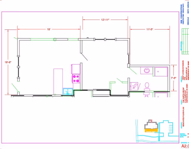 Architectural floor plan showing the layout of a residential unit including a kitchen area with stove and sink, a bathroom with toilet and sink, and other rooms with dimensions marked in feet and inches.
