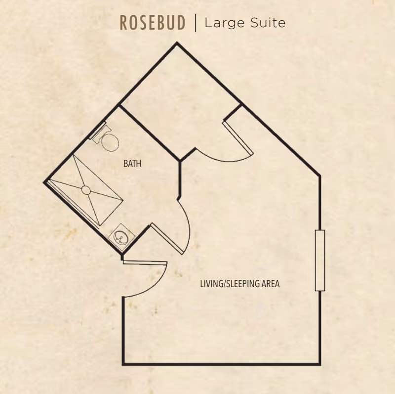 Floor plan of the Rosebud large suite at Heron East, showing a living/sleeping area and a bathroom with a shower, toilet, and sink.