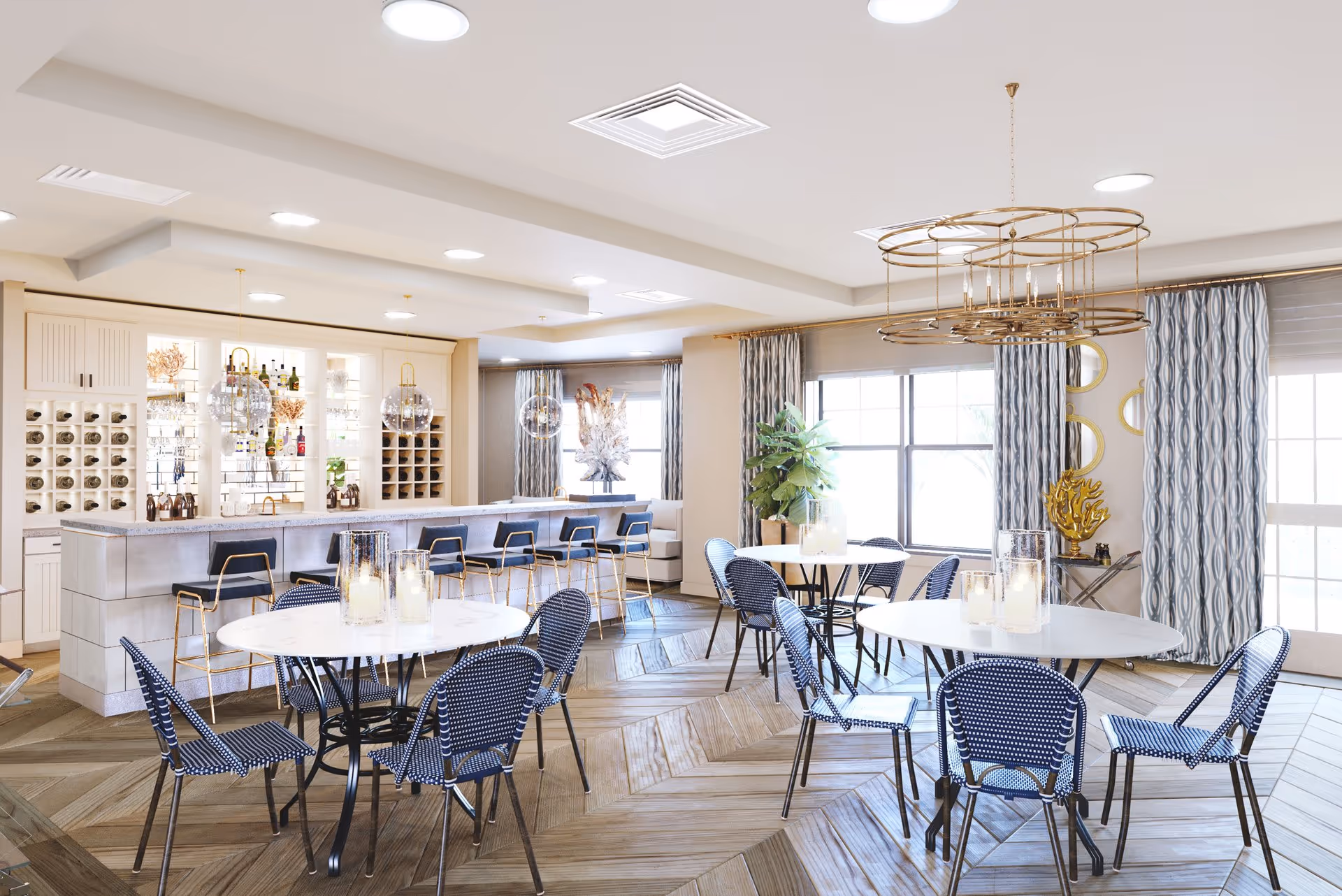 Bright communal dining area with round tables and blue woven chairs, a bar with stools, and decorative lighting.