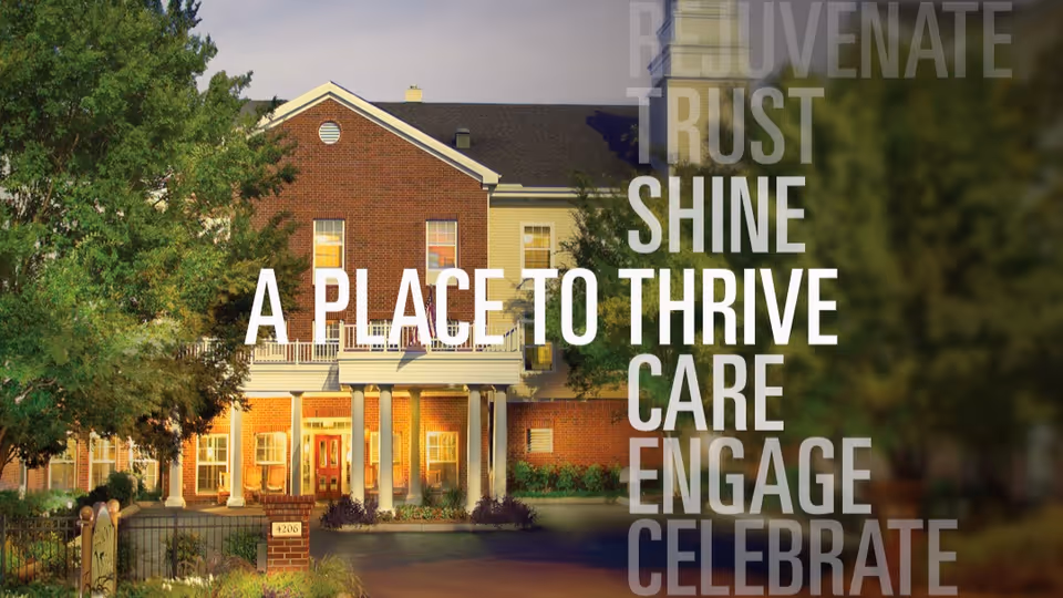 Exterior view of a senior living facility building with brick and light-colored siding, surrounded by trees and greenery. The building has multiple windows and a covered entrance with columns. Overlaid text reads: 'REJUVENATE TRUST SHINE A PLACE TO THRIVE CARE ENGAGE CELEBRATE'.