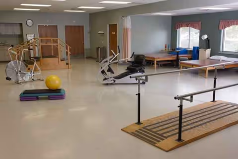 Rehabilitation gym in Willows Nursing and Rehab with exercise equipment and therapy mats.