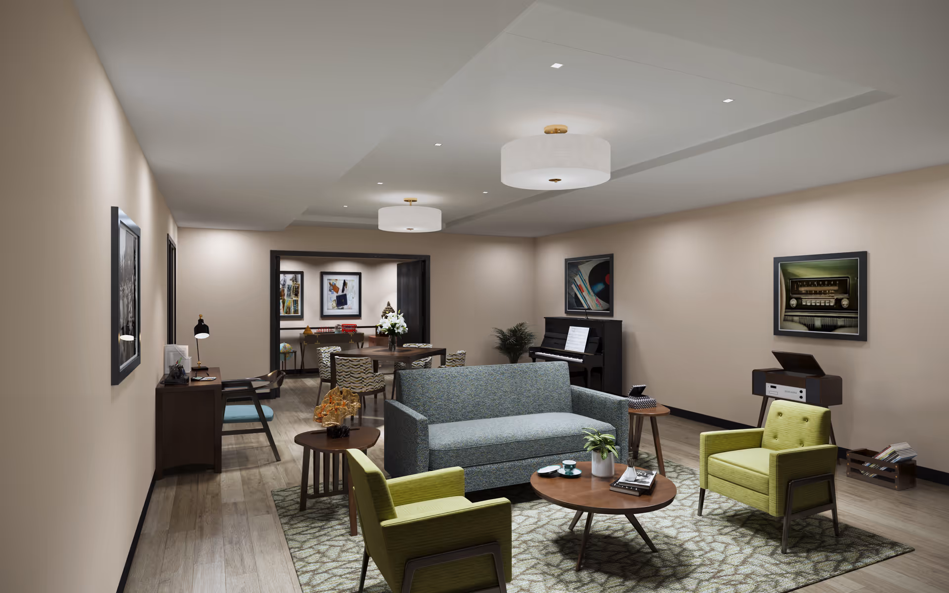 A cozy living room area with a blue sofa, two green armchairs, and three wooden tables on a patterned rug. The room features a piano against the back wall, framed pictures on the walls, and a record player with a crate of records. In the background, there is a dining table with chairs and decorative items on a side table. The ceiling has recessed lighting and two round ceiling lights.