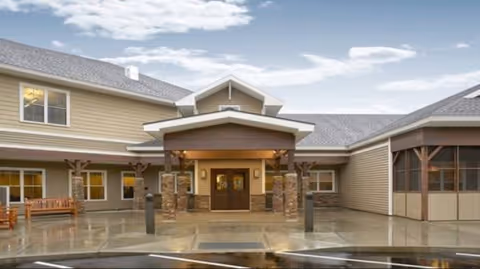 Front exterior view of Valley Residential Services facility with a covered main entrance and stone columns.