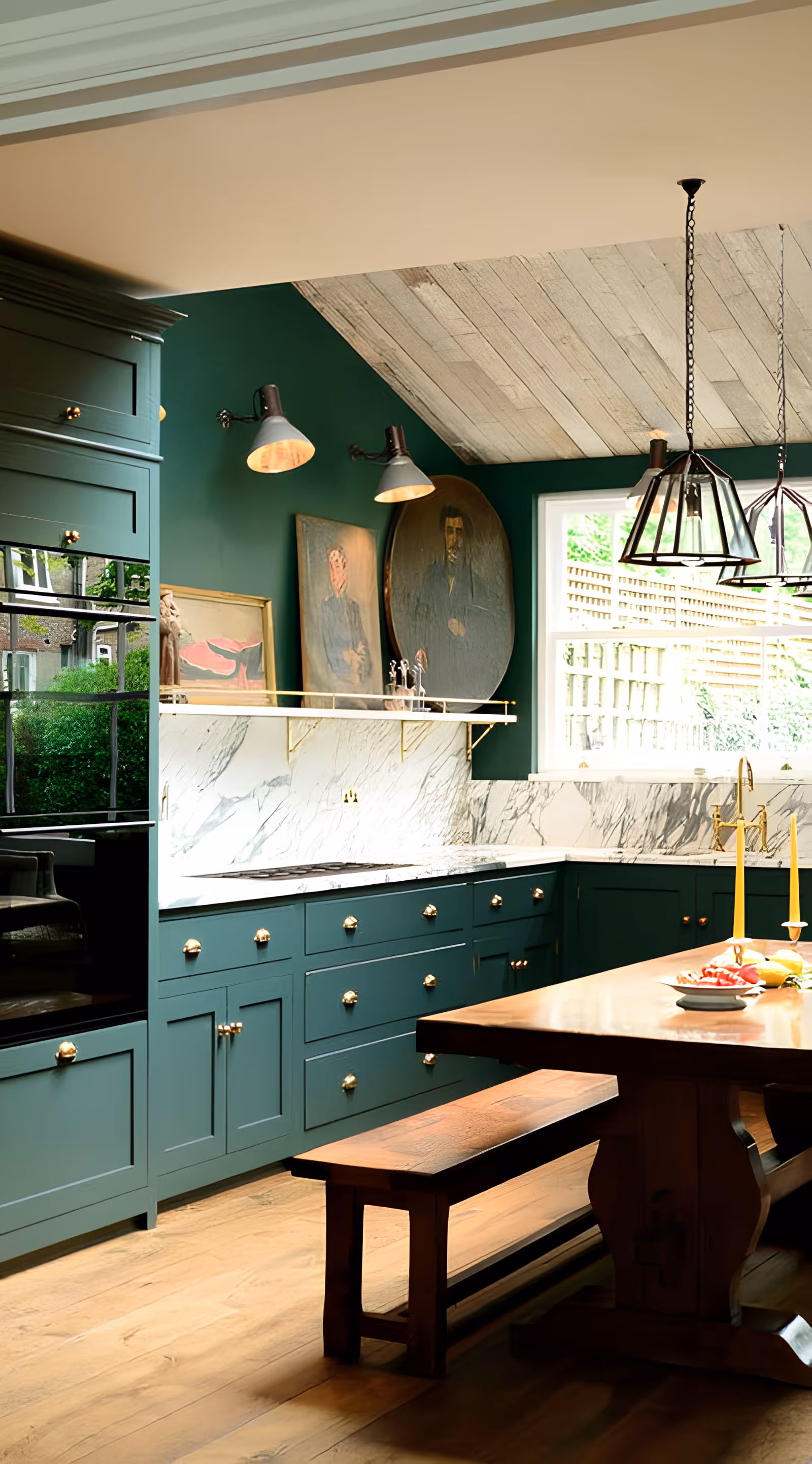 Sunlit kitchen with green cabinetry, marble backsplash, wooden island and bench, pendant lights, and artwork by a window.