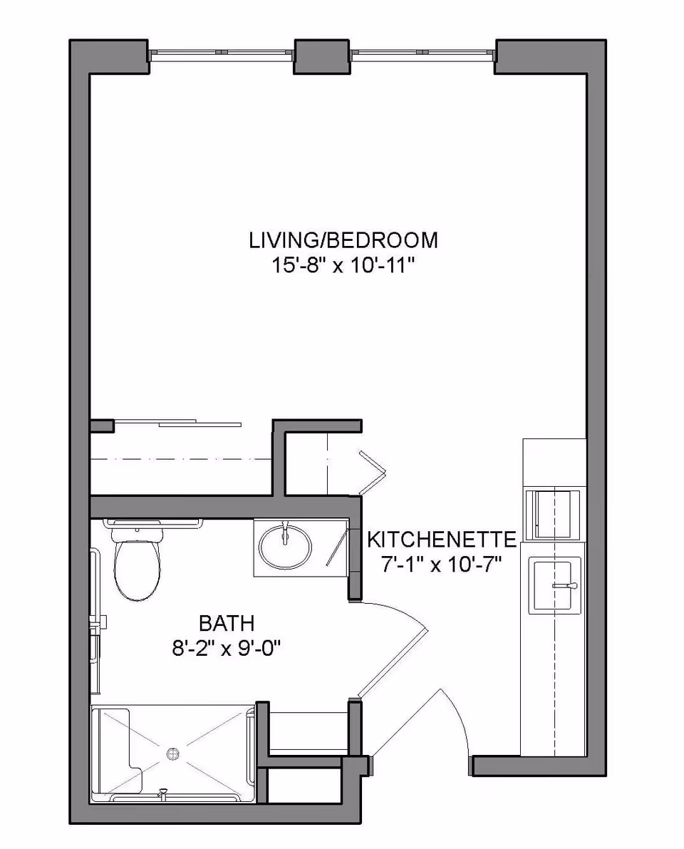 Architectural floor plan of a small living space at Heritage Woods of Noblesville showing a living/bedroom area measuring 15 feet 8 inches by 10 feet 11 inches, a kitchenette measuring 7 feet 1 inch by 10 feet 7 inches, and a bathroom measuring 8 feet 2 inches by 9 feet with a toilet, sink, and shower.