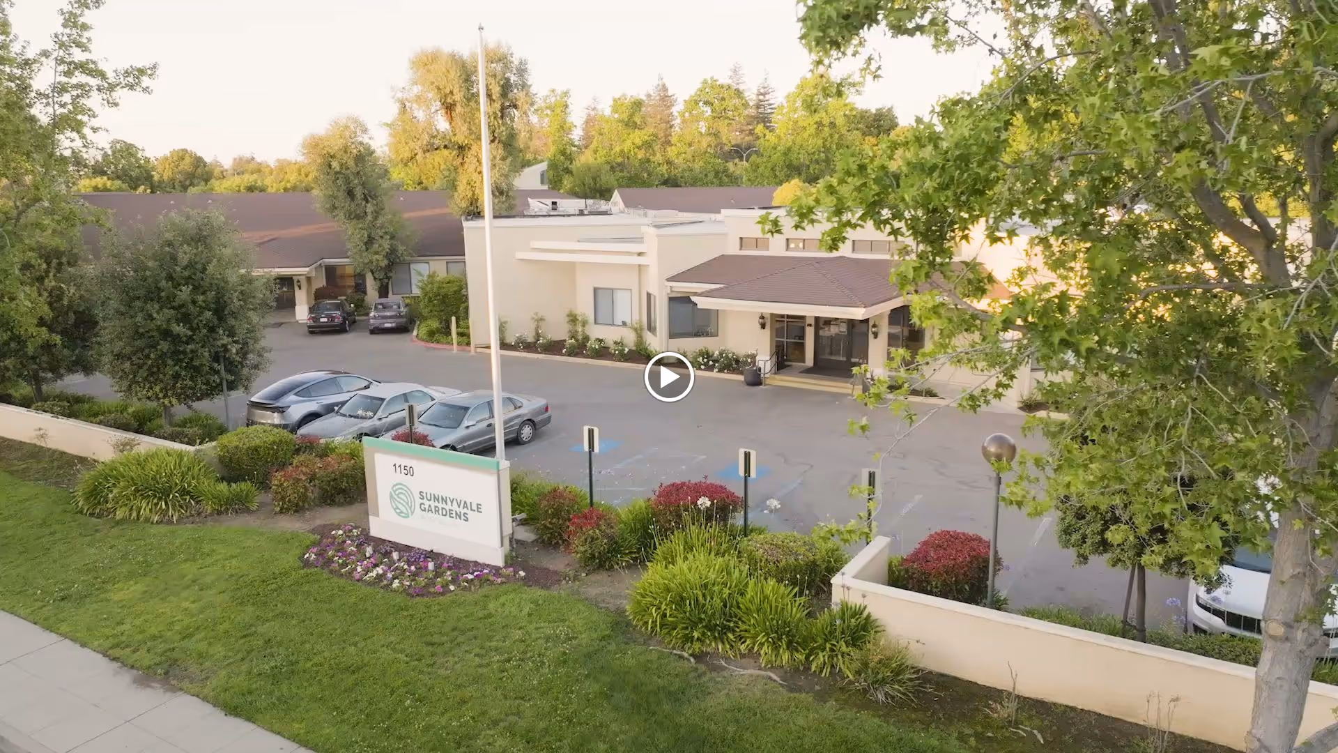 An aerial view of Sunnyvale Gardens Post Acute senior living facility showing landscaped grounds and entrance.