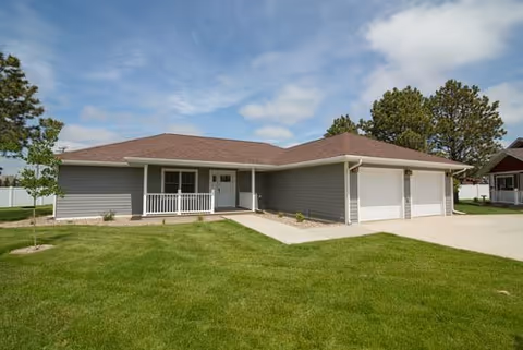 Edgewood Hawks Point retirement facility with a front porch and two garage doors.