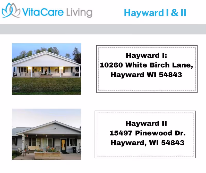 Two single-story residential buildings with porches and outdoor seating, labeled as Hayward I and Hayward II, part of VitaCare Living in Hayward, Wisconsin.