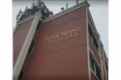Exterior view of a multi-story building with the name Central Island Healthcare displayed on the side in gold letters.