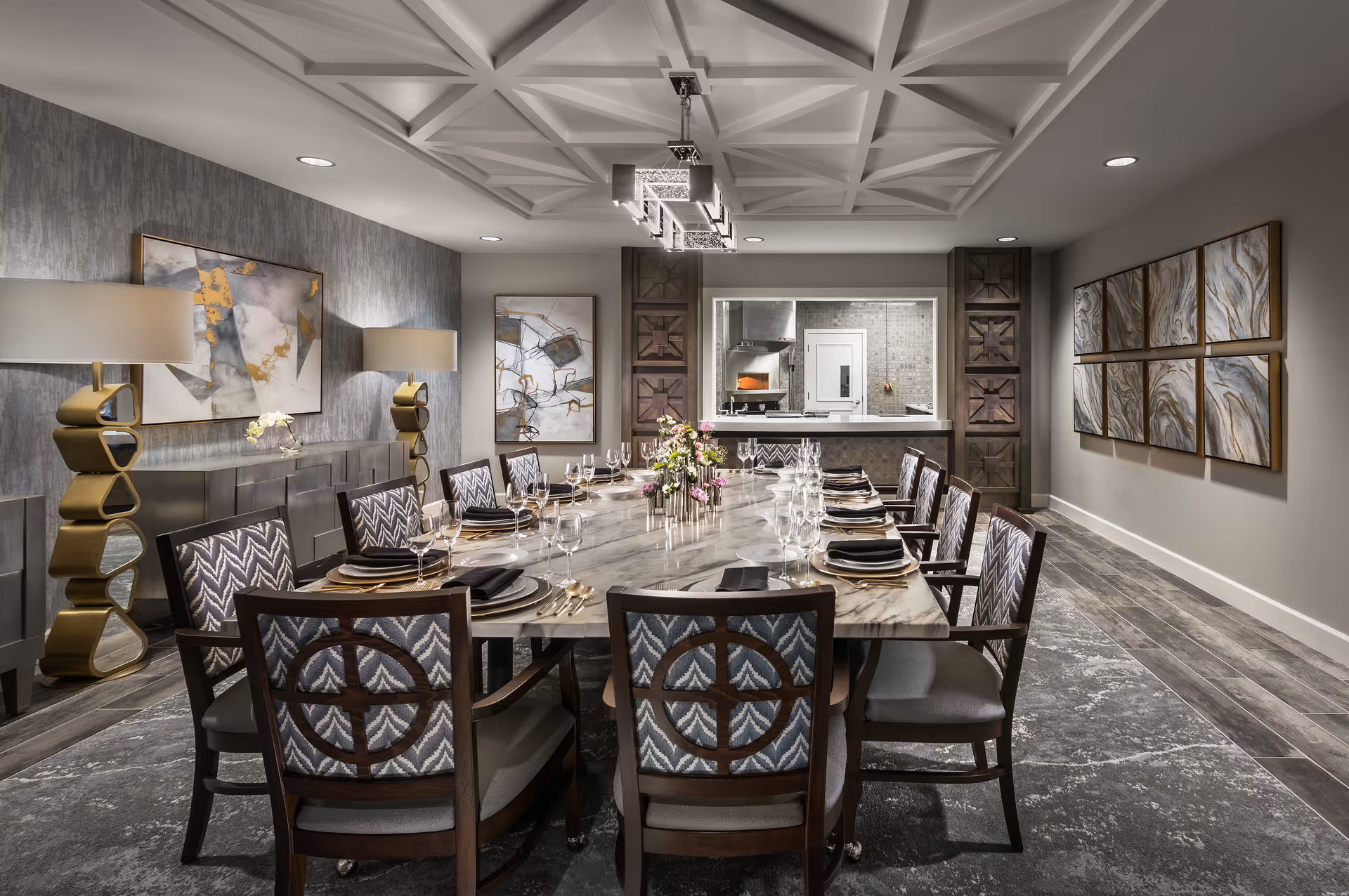 Elegantly set dining room with a long marble table, upholstered chairs, modern chandelier and artwork on the walls.