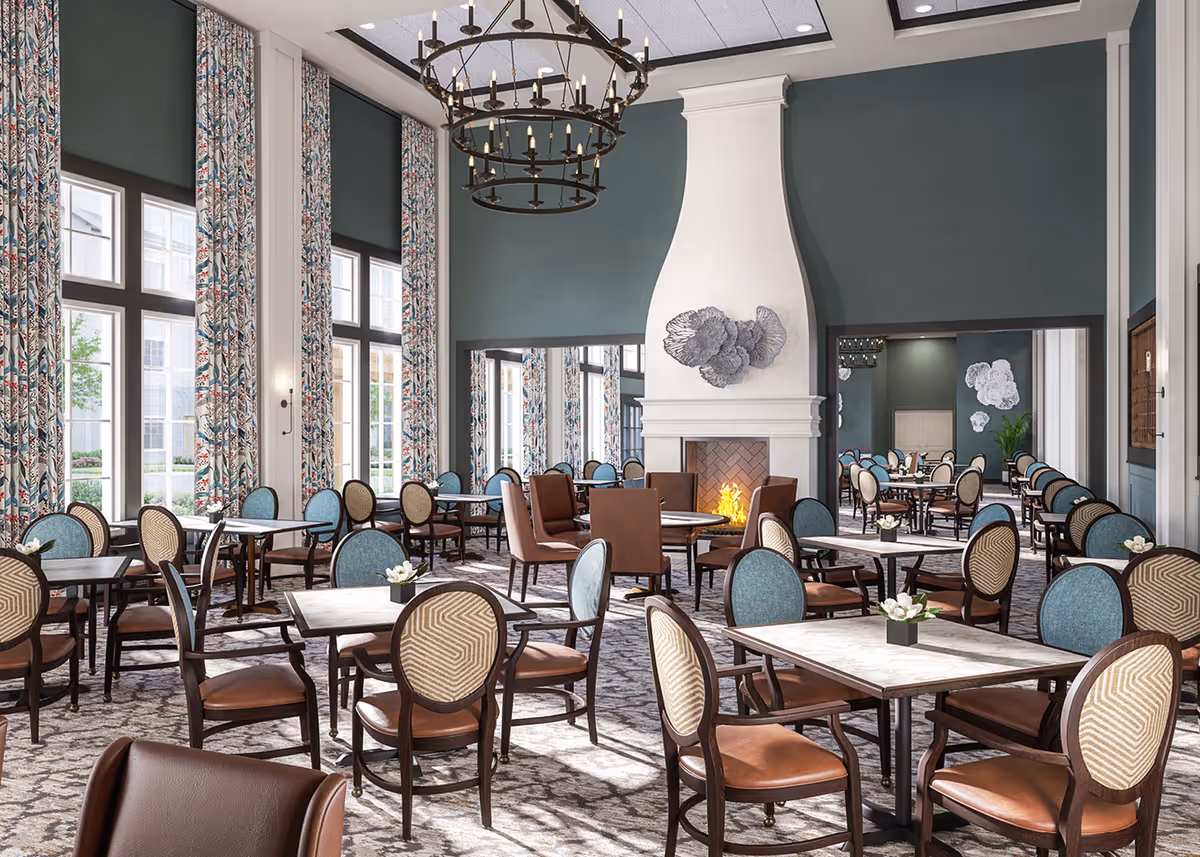 Spacious dining room with multiple tables and chairs, high ceilings, large windows with patterned curtains, and a central fireplace.