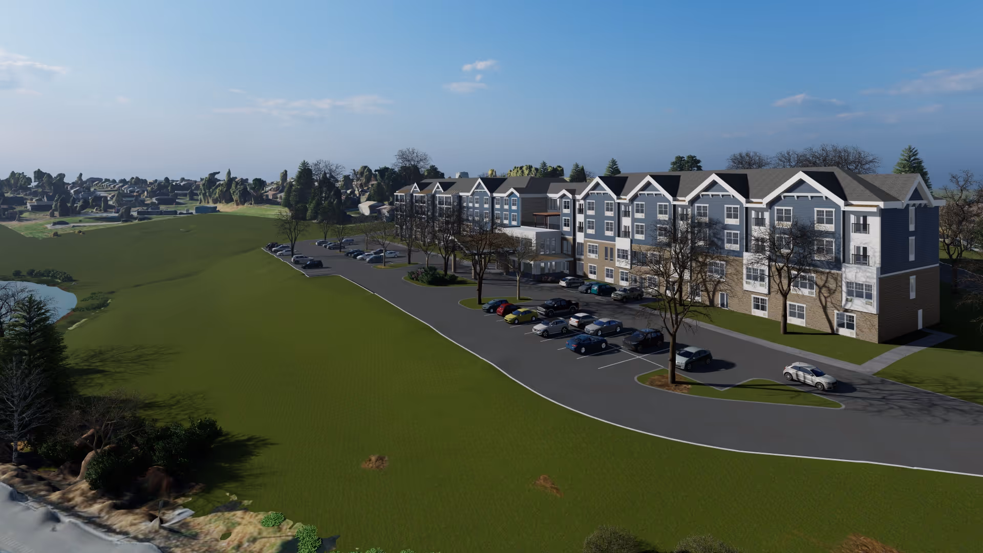 A large, multi-story senior living facility building with a parking lot in front, surrounded by green lawns and trees under a clear blue sky.