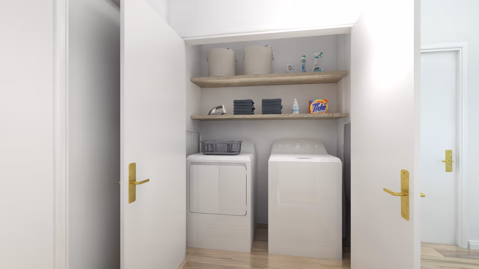Open closet-style laundry area with a washer and dryer beneath two wooden shelves holding baskets and laundry supplies.