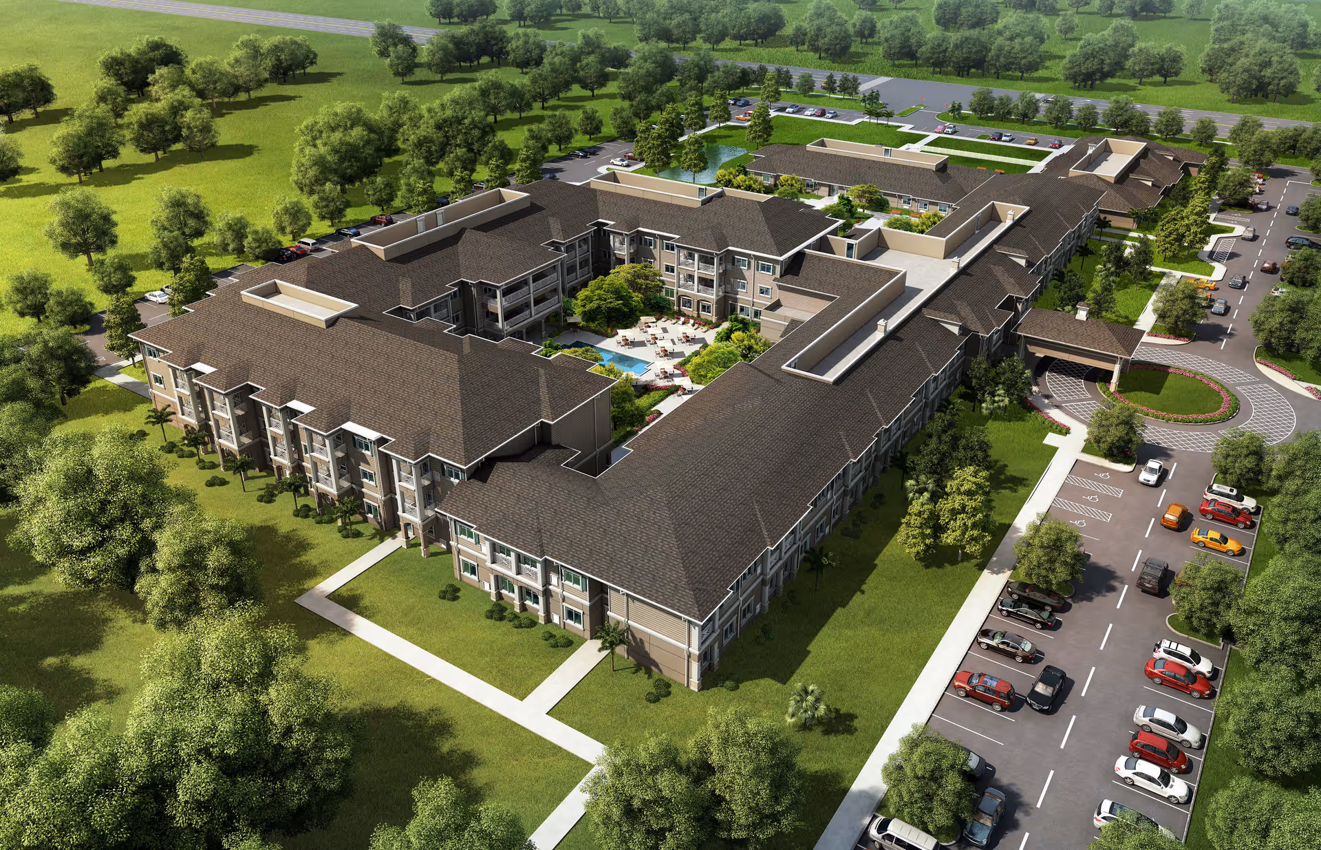 Aerial view of American House St. Petersburg senior living facility showing a large, U-shaped building surrounded by green lawns and trees. The building has multiple floors with balconies, and there is a central courtyard with outdoor seating and a pool. Parking lots with cars are visible on the right side of the building, along with a circular driveway at the entrance.