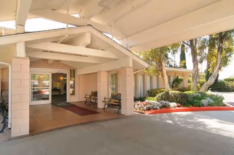 Entrance to Mirada Hills Rehabilitation and Convalescent Hospital with benches.