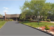 Front exterior of Life Care Center of Athens, a single-story brick senior living facility.