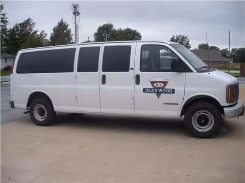 White Glenwood Rehabilitation and Health Care Center van parked outside.