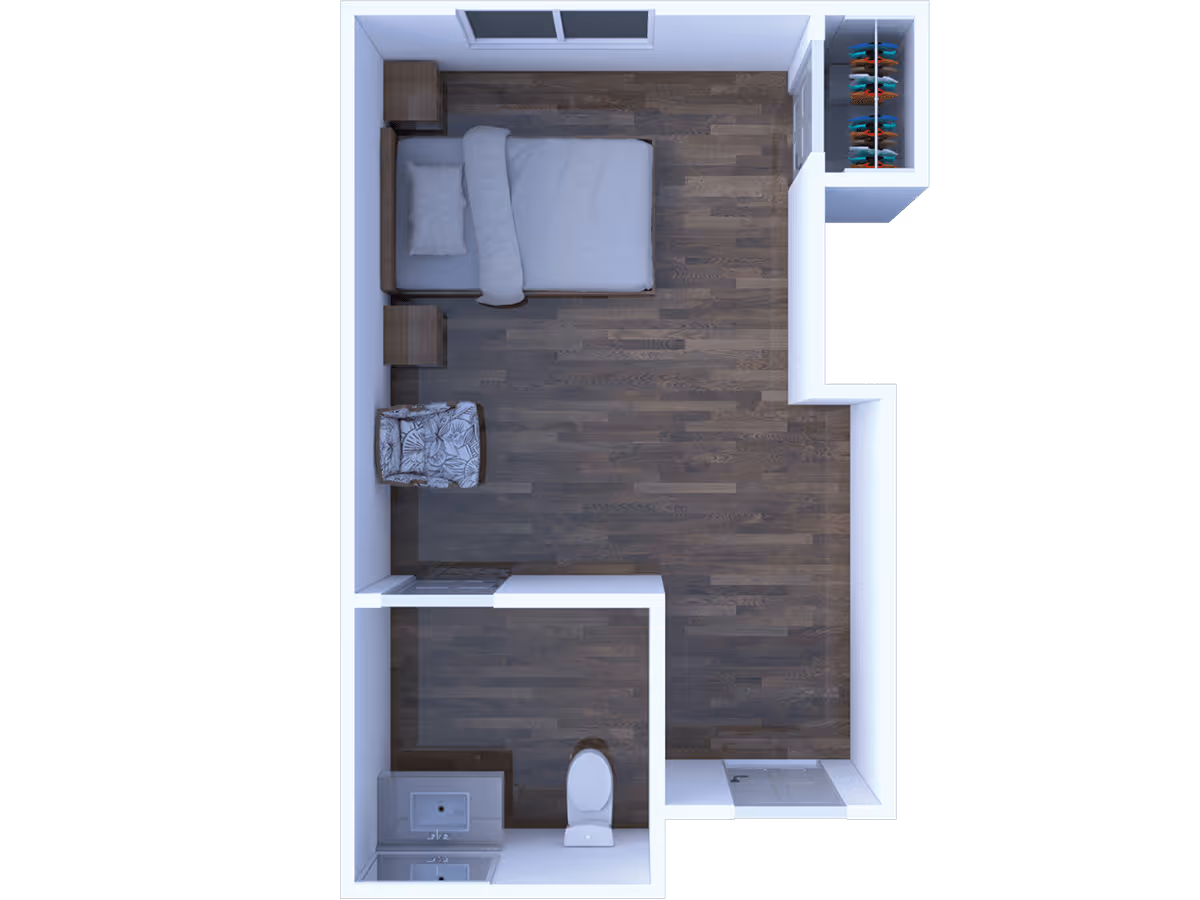 Top-down view of a small apartment layout featuring a bedroom area with a bed, two nightstands, a chair, and a closet with hanging clothes. There is a separate bathroom with a toilet and a sink. The flooring is dark wood throughout.